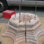 As only one original capital of the two smaller pillars had survived, a replacement was made by potter Alison Robinson in modern Coade Stone.